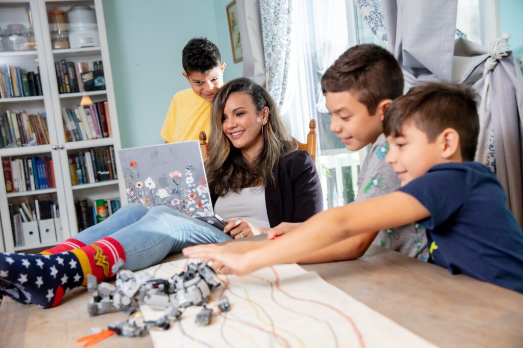 Rebeca and her kids in the living room